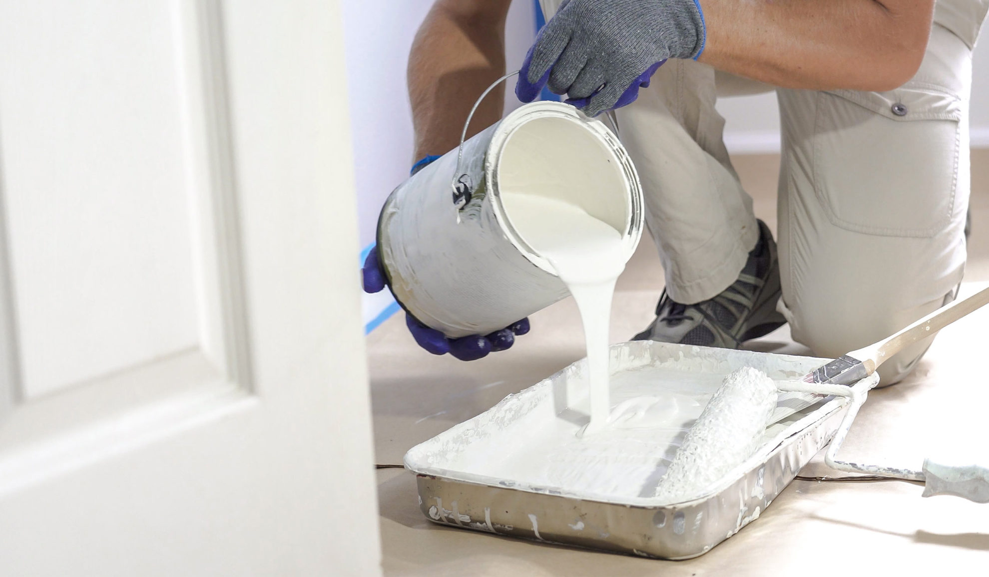 contractor preparing white paint for house interior painting process cincinnati oh